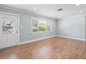 Bright living room with hardwood floors and large window at 2347 Eastwood Dr, Clearwater, FL 33765