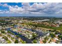 Aerial view of waterfront home with private dock and canal access at 165 97Th Ne Ave, St Petersburg, FL 33702