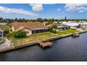 Single-Gathering home with backyard and private dock on canal at 165 97Th Ne Ave, St Petersburg, FL 33702