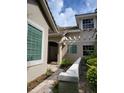 Two-story house with walkway and landscaping at 379 Fan Palm Ne Ct # 0, St Petersburg, FL 33703