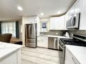 Modern kitchen featuring stainless steel appliances and white cabinets at 5750 80Th N St # C108, St Petersburg, FL 33709