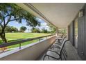 Spacious balcony with patio furniture and golf course view at 36750 Us Highway 19 N # 13202, Palm Harbor, FL 34684