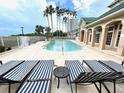 Resort-style pool with striped lounge chairs at 2201 Bay Club Cir, Tampa, FL 33607