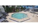 Relaxing hot tub surrounded by lush landscaping at 2201 Bay Club Cir, Tampa, FL 33607