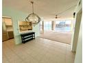 Spacious living room featuring tile floors, modern lighting, and panoramic water views at 100 Pierce St # 703, Clearwater, FL 33756