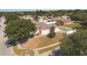 Aerial view of a residential area showing houses and streets at 14580 Wake Robin Dr, Brooksville, FL 34604