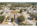 Wide aerial view of a residential neighborhood with various houses at 14580 Wake Robin Dr, Brooksville, FL 34604