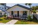 Charming house exterior with a front porch and landscaped yard at 316 11Th N Ave, St Petersburg, FL 33701