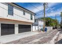 Exterior view of the home's spacious two-car garage and brick-paved street at 316 11Th N Ave, St Petersburg, FL 33701