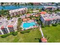 Condo community with pool, lush landscaping and waterway views at 7532 Bayshore Dr # 205, Treasure Island, FL 33706