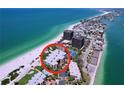Gorgeous aerial view of a beachfront condo with beautiful ocean views near the city at 7532 Bayshore Dr # 205, Treasure Island, FL 33706