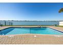 Community pool with waterfront view at 800 Madonna Blvd # B, Tierra Verde, FL 33715