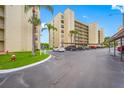 Parking area with covered parking for residents at 900 Cove Cay Dr # 1F, Clearwater, FL 33760