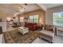 Living room with fireplace and comfy seating at 18 Heilwood St, Clearwater Beach, FL 33767