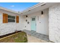 Stylish home entrance with a light blue door, decorative stars, and a patterned walkway at 508 Brooker Rd, Brandon, FL 33511