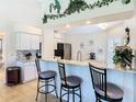 Beautiful kitchen featuring granite countertops, stainless steel appliances and breakfast bar seating at 11247 Corey Pavin Ln, San Antonio, FL 33576