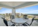 Balcony with patio furniture and stunning ocean view at 5830 Midnight Pass Rd # 705, Sarasota, FL 34242