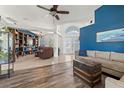 Spacious living room with hardwood floors and built-in shelving at 7162 Benson St, Englewood, FL 34224
