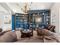 Cozy library with built-in shelves and leather seating at 7162 Benson St, Englewood, FL 34224