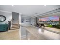 Bright interior with stairs and water view at 158 Brightwater Dr # 1, Clearwater Beach, FL 33767