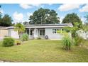 Newly renovated home with solar panels and a spacious lawn at 5575 6Th N Ave, St Petersburg, FL 33710