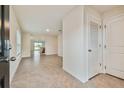 Bright and spacious entryway with tile floors at 5552 Logan Cave Ave, Wimauma, FL 33598