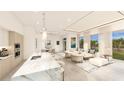 Open-concept living and kitchen with modern design at 5701 Bowen Daniel Dr. # 1 Villa, Tampa, FL 33616