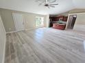 Spacious living area with light gray vinyl plank flooring at 1495 Robwood Ter, North Port, FL 34288