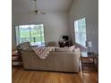 Living Room with light beige couch and wood floors at 2367 N Bentley Dr, Palm Harbor, FL 34684