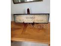 Home decor sign on a wooden table at 2367 N Bentley Dr, Palm Harbor, FL 34684