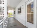 Inviting outdoor hallway of building featuring unit 214, enhanced by natural light and architectural details at 3128 59Th S St # 214, Gulfport, FL 33707