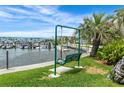 Relaxing waterfront view featuring a swing and lush greenery, creating a tranquil and inviting atmosphere at 3128 59Th S St # 214, Gulfport, FL 33707