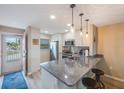 Modern kitchen with stainless steel appliances and granite countertops at 175 116Th Ave # 102, Treasure Island, FL 33706