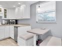 Kitchen breakfast nook with built-in seating at 5130 Brittany S Dr # 106, St Petersburg, FL 33715