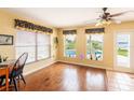 Bright breakfast room with hardwood floors and lake views at 22607 Southshore Dr, Land O Lakes, FL 34639