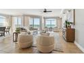 Bright living room featuring beach views, comfortable seating, and neutral tones, creating a relaxing atmosphere at 19820 Gulf Blvd # 401, Indian Shores, FL 33785