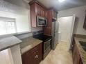 Kitchen with granite countertops and stainless steel appliances at 455 Alt 19 S # 21, Palm Harbor, FL 34683