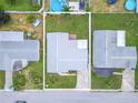 House and yard aerial view, showing surrounding houses at 3543 Seffner Dr, Holiday, FL 34691