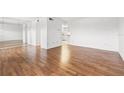Living room with hardwood floors and view of kitchen at 5080 Locust Ne St # 329, St Petersburg, FL 33703