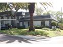 Condo building with palm tree and carport at 1211 N Mcmullen Booth Rd # 1211, Clearwater, FL 33759