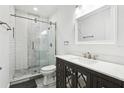 Modern bathroom features a glass-enclosed shower and vanity with stylish mirror accents at 2272 Chianti Pl # 4-0048, Palm Harbor, FL 34683