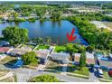 House with lake access and a large backyard at 4638 Koala Dr, Holiday, FL 34690