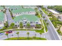 Aerial view of a luxurious townhome community with green roofs at 6 Hibiscus Ln, Belleair, FL 33756
