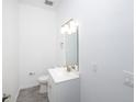 Clean bathroom with white vanity and gray floor tile at 7535 62Nd N Way, Pinellas Park, FL 33781