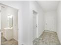 Bright hallway with access to bathroom and another room at 7535 62Nd N Way, Pinellas Park, FL 33781
