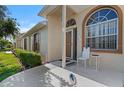 Front entrance with a chair and small table at 9314 Alta Sol Way, New Port Richey, FL 34655