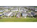 Aerial view of a community with houses and green spaces at 13043 Pennybrook Dr, Riverview, FL 33579