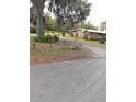 Property front view, showcasing the house and surrounding landscape at 1401 W Spencer St, Plant City, FL 33563