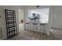 This charming kitchen features stone counter tops and bar seating at 6177 Sun Blvd # 108, St Petersburg, FL 33715