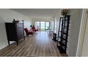 Open living space boasts wood floors, comfortable seating and water views at 6177 Sun Blvd # 108, St Petersburg, FL 33715